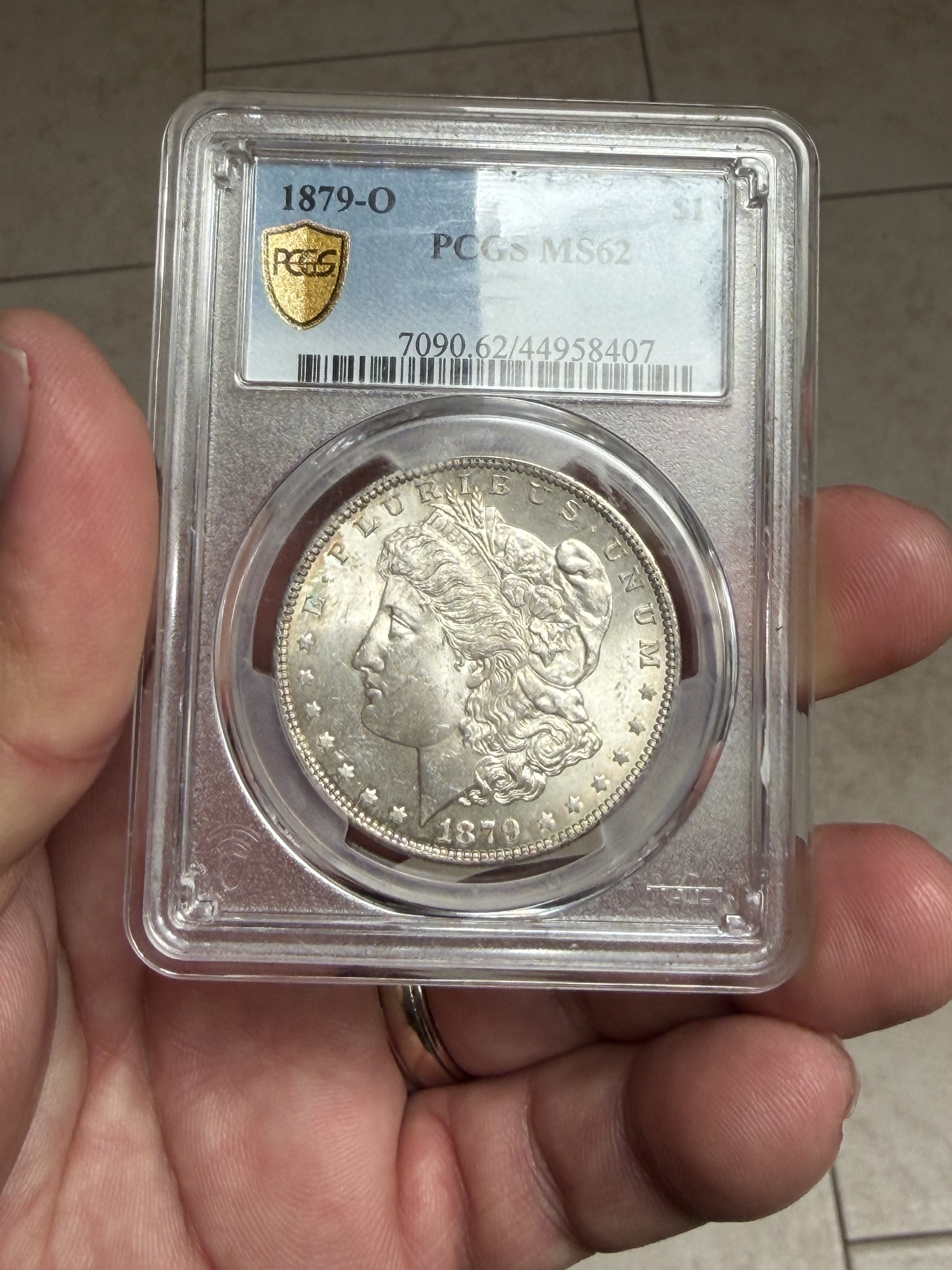 1879-O Morgan dollar in a PCGS MS62 holder