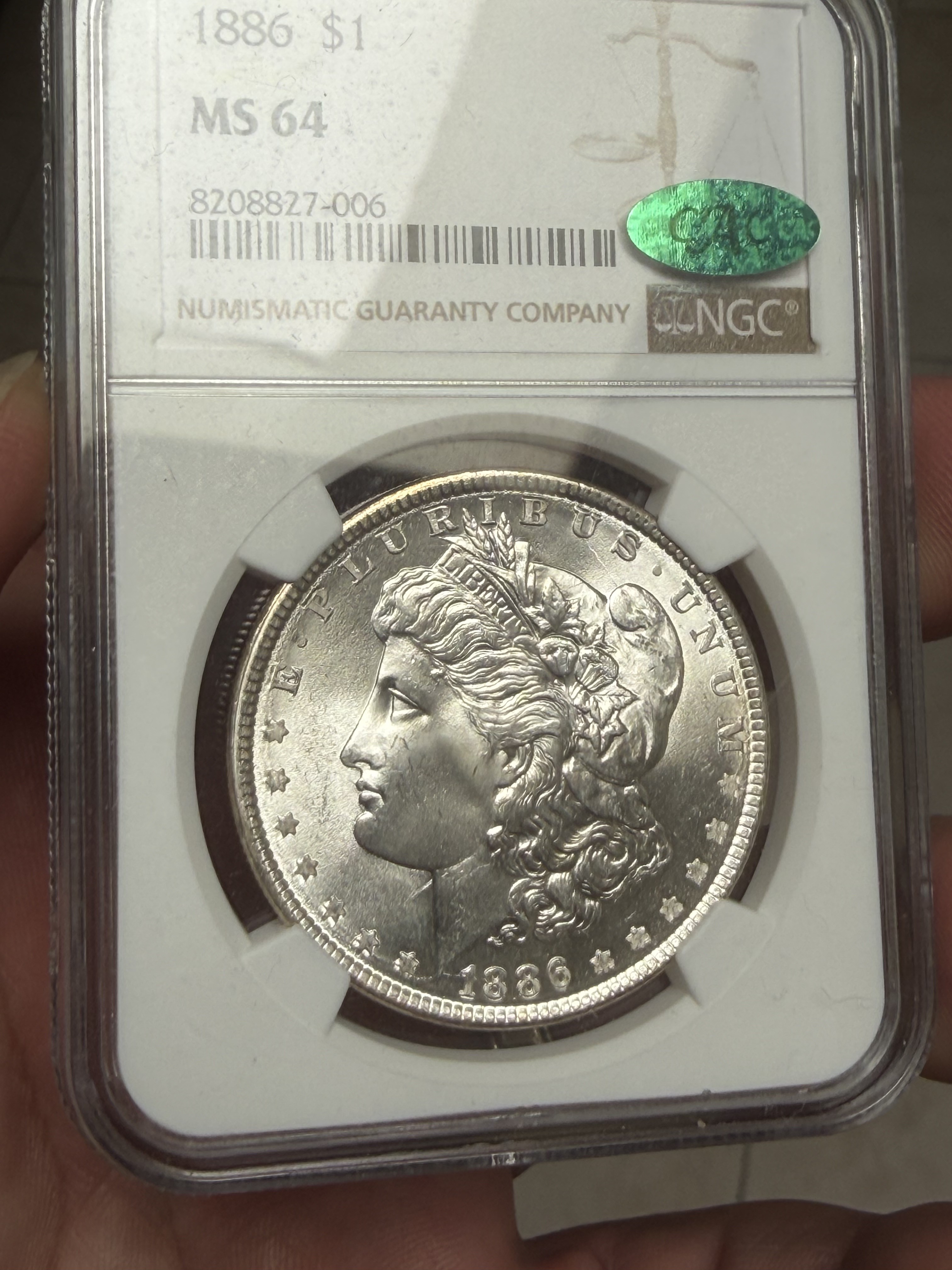 1886 Morgan dollar in an NGC MS64 holder